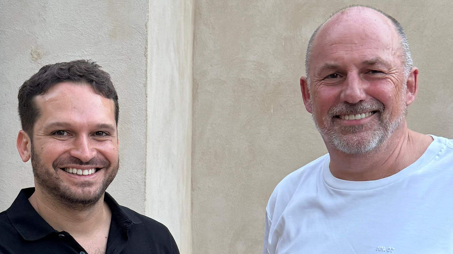 D-ID CEO Gill Perry and simpleshow CEO Karsten Boehrs standing side by side, smiling at the camera.